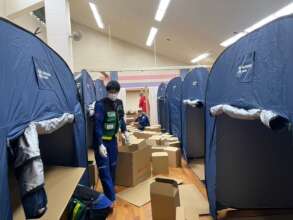 Setting up tents and supplies at evacuation center