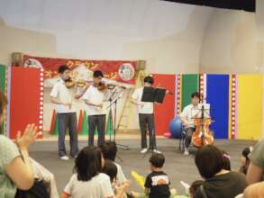 Middle school students perform at Children's Plaza