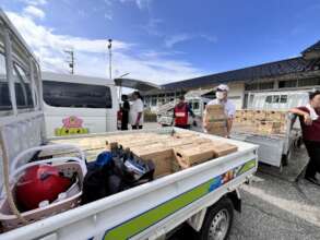 Distributing bottled water at evacuation centers