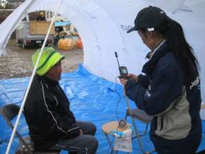 Rika sets up satellite phones (Kesennuma 2011)
