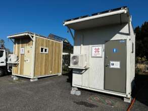 Temporary toilets set up outside evacuation center