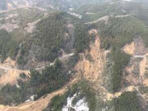 View of landslide and damaged road from helicopter