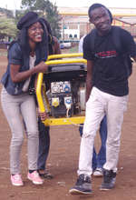 Kibera Film School trainees carry equipment