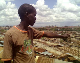 Ignatius pointing to Kibera, where he lives