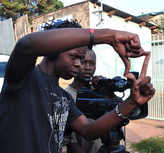 Josphat assisting Vincent during filming