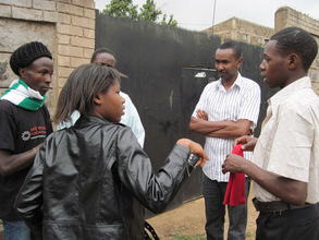 Ian Mbugua watching students rehearse