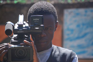 Josphat Keya filming his project at Kibera Film School