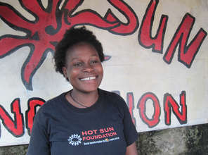 Quenter outside Hot Sun Foundation office