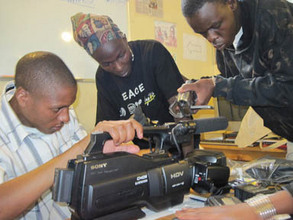 Trainees learning about their new camera
