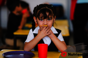 Little Girl Eating Fruit