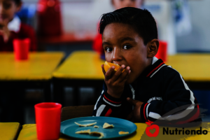 Little Boy Eating Fruit & Nutriendo Shake