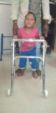 A child learns to walk with the  modified walker