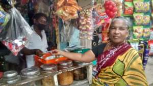 A relieved Saroja buying provisions for the family