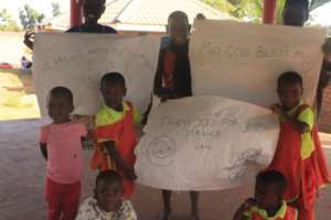 Children with thank you charts