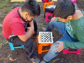 Students play different types of games like chess.