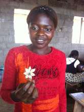 A Trainee displaying the flower she produced