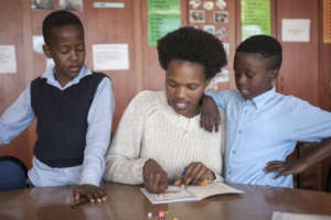 Youth reading with children