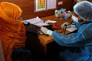 IRC paramedics screening Sakera in triage section.