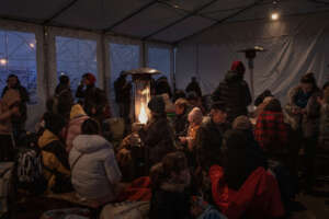 Ukrainian refugees trying to keep warm