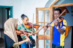 DCMA students practice music together.