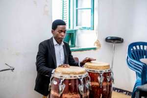 DCMA student practices the drums.