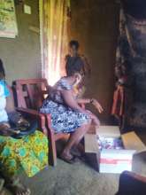 Beneficiary receiving nutritious feeds(RUTF)