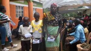 Beneficiaries receiving scholastic materials