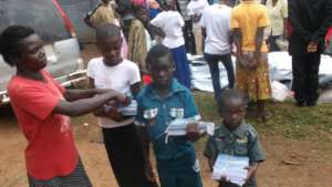 Beneficiaries receiving scholastic materials