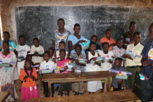 Beneficiaries receiving scholastic materials