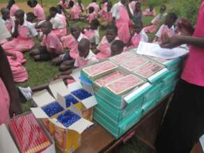 Beneficiaries receiving scholastic materials