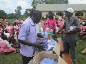 Beneficiaries receiving scholastic materials