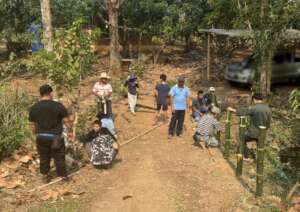 Relatives joined us to make a fence between ponds