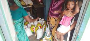 Mother & child receiving emergency relief package