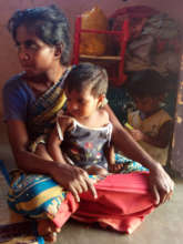A mother and her children at their home