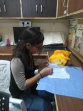 volunteer preparing gauze pieces