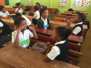 Children enjoying YOUPSA's counting game
