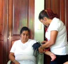 A student practicing taking blood pressure