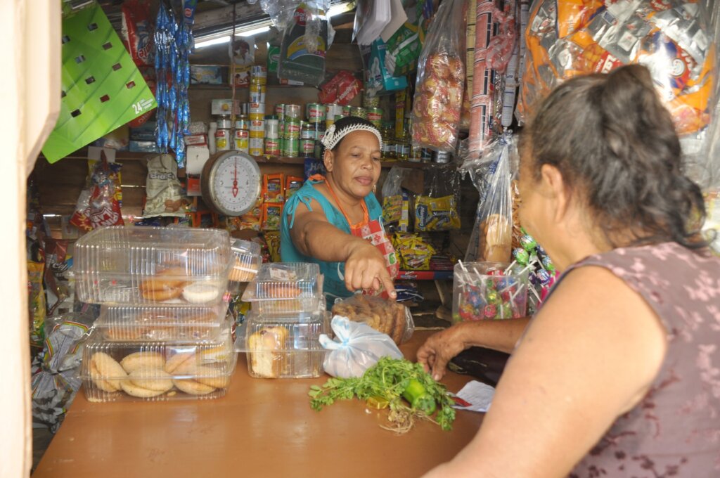Maritza collecting water tank payments