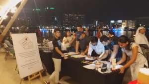 Sean at his Pop-Up, collecting letters, in Dubai