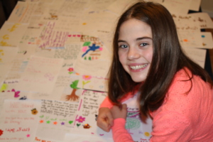 Gabby with the handwritten letters she collected
