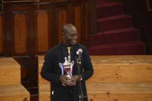 MR Happy X Receiving the Trophy