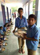 Older Boys at school helping serve the food
