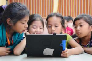 Students use the RACHEL program on a tablet