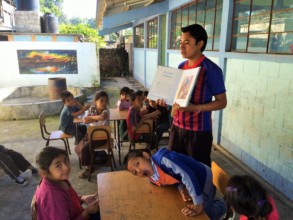 School librarian, Julio, reads to the children