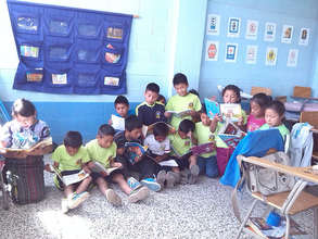 Students crowding around a mini-library