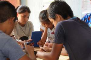 Students follow along on their tablets