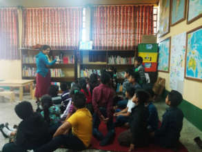 Lidia leads an activity in the library