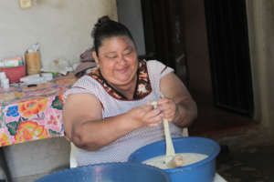 Dalila making cheese