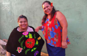 Iris and Rosa, embroidery and dress made by them