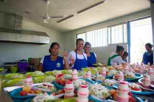 Mom Volunteers Serving Food for Children